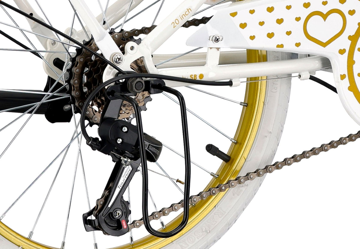 20-inch girls' bike with a 6-speed Shimano Tourney cassette and a Revoshift Heart Bike shifter, gold and white