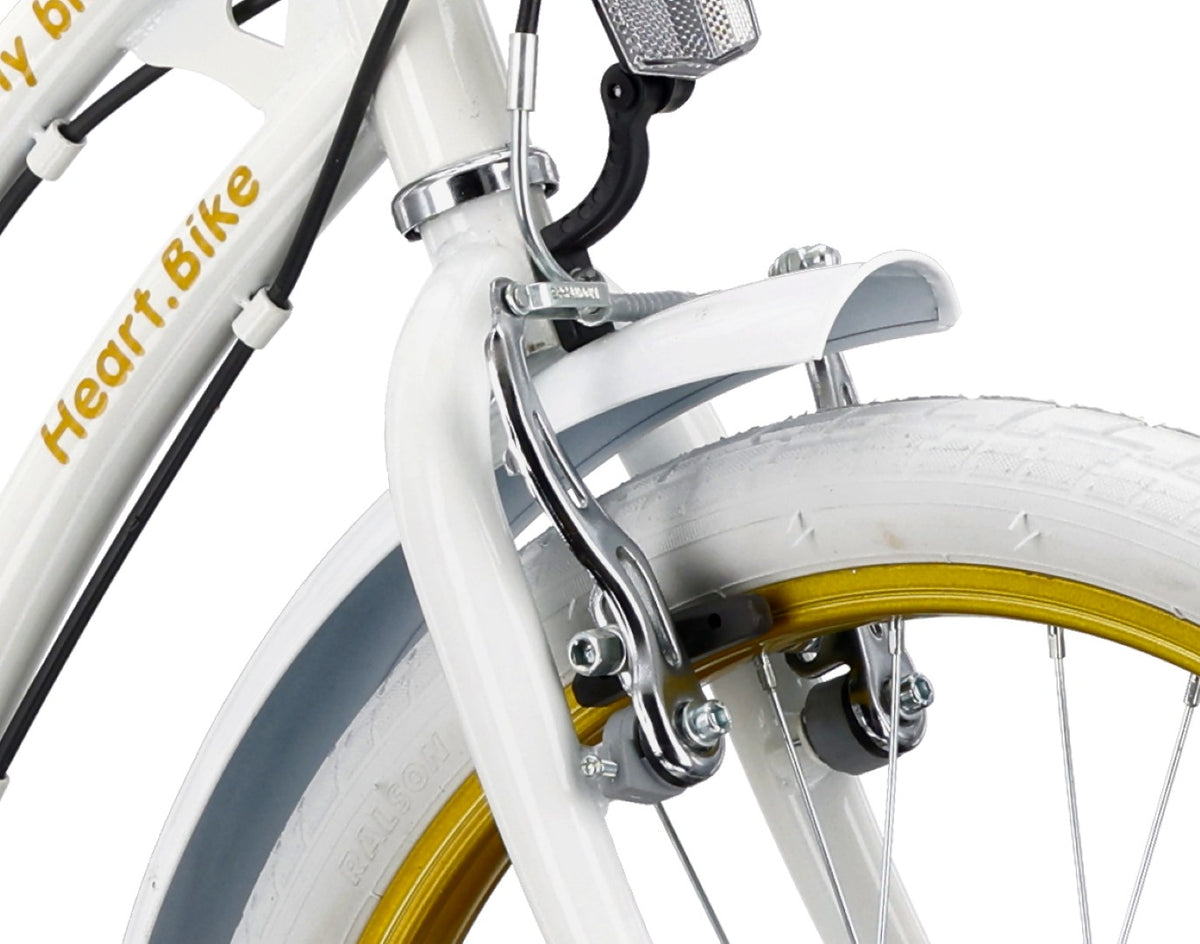 20-inch girls' bike with a 6-speed Shimano Tourney cassette and a Revoshift Heart Bike shifter, gold and white