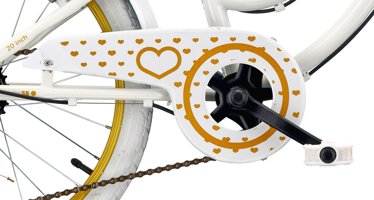 20-inch girls' bike with a 6-speed Shimano Tourney cassette and a Revoshift Heart Bike shifter, gold and white