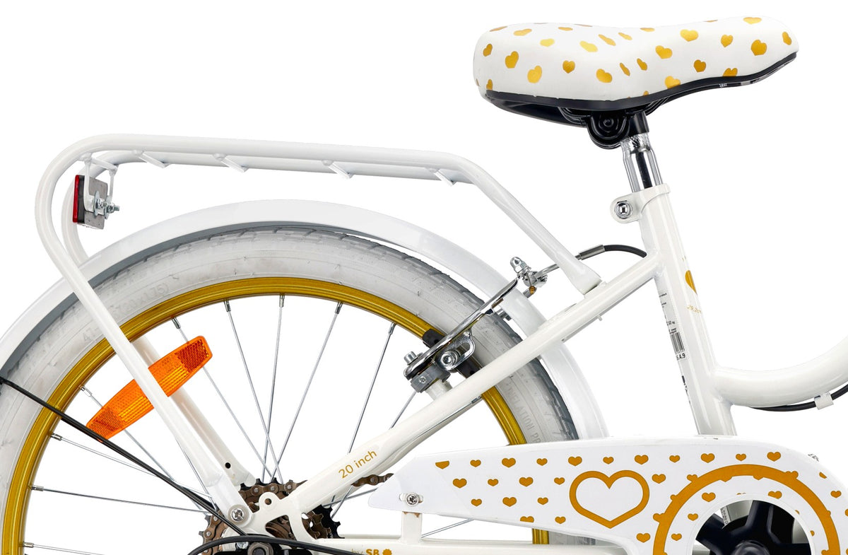 20-inch girls' bike with a 6-speed Shimano Tourney cassette and a Revoshift Heart Bike shifter, gold and white