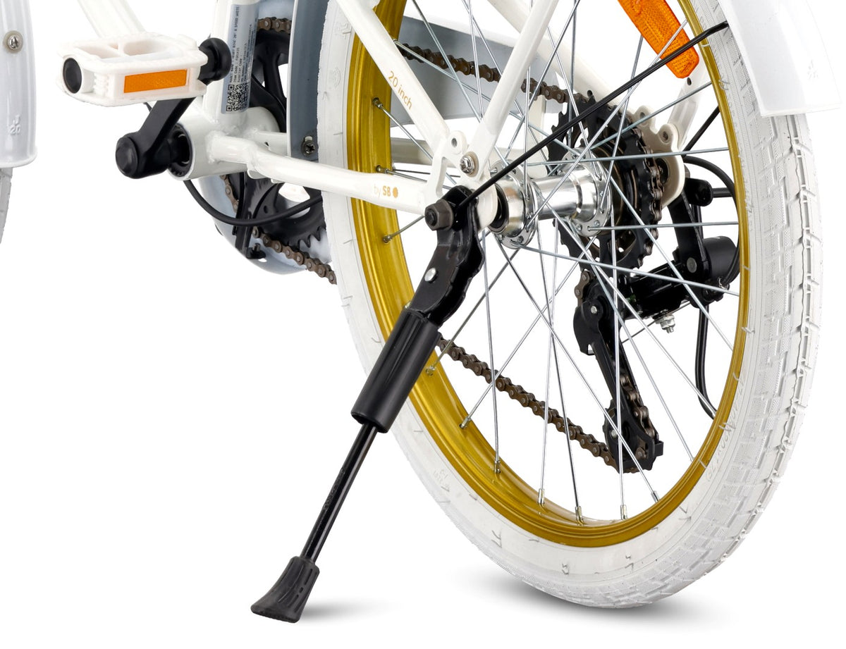 20-inch girls' bike with a 6-speed Shimano Tourney cassette and a Revoshift Heart Bike shifter, gold and white