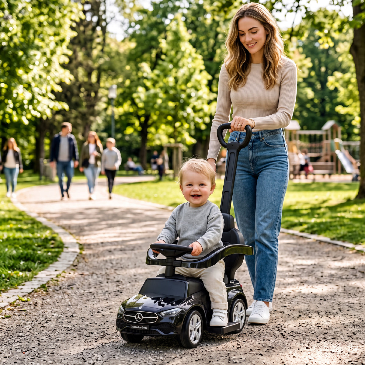 Sun Baby jeździk Mercedes C-Class z popychaczem, podnóżkiem i barierką, siedzisko ze skóry PU, czarny